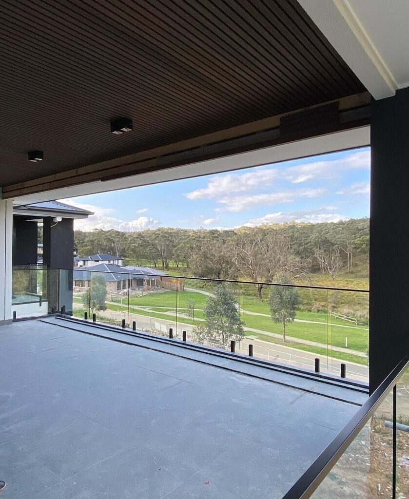 outdoor view with framed glass railing balcony