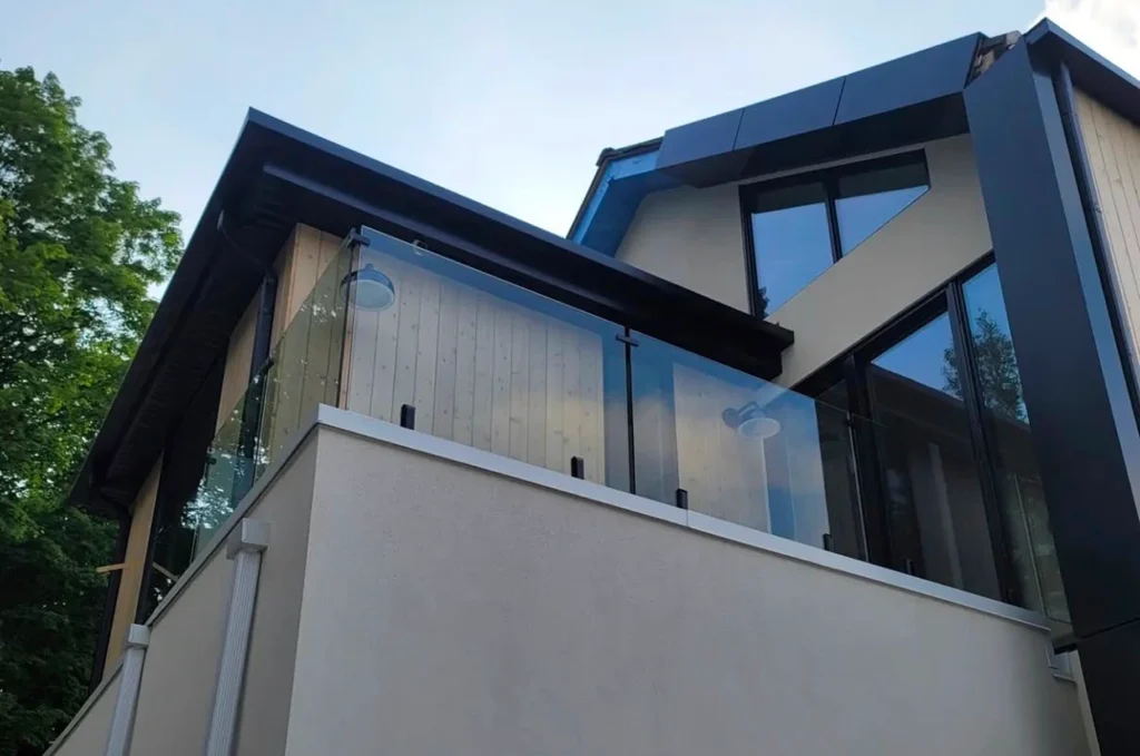 Residential balcony with premium glass railing and contemporary design.