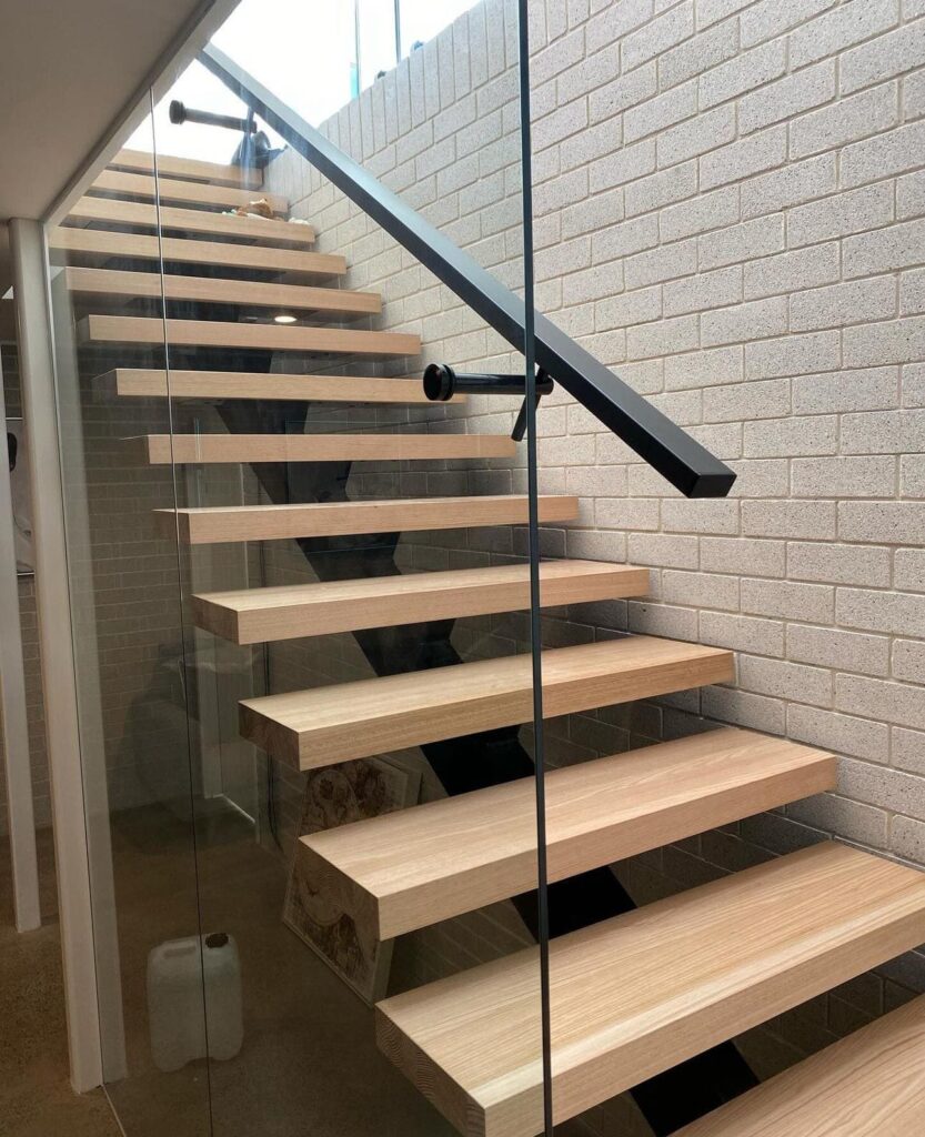 Indoor glass railing with stairs in the house