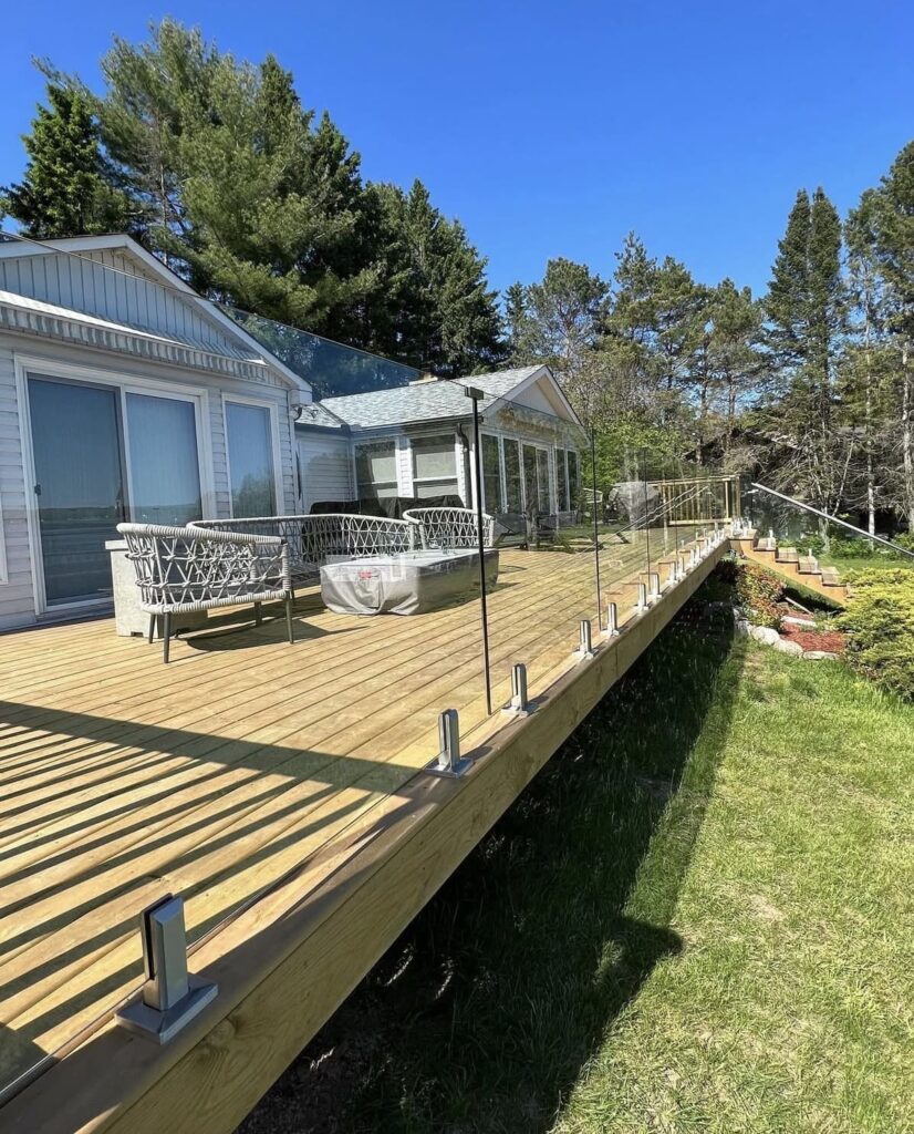 Yard balcony with outdoor glass railing installation
