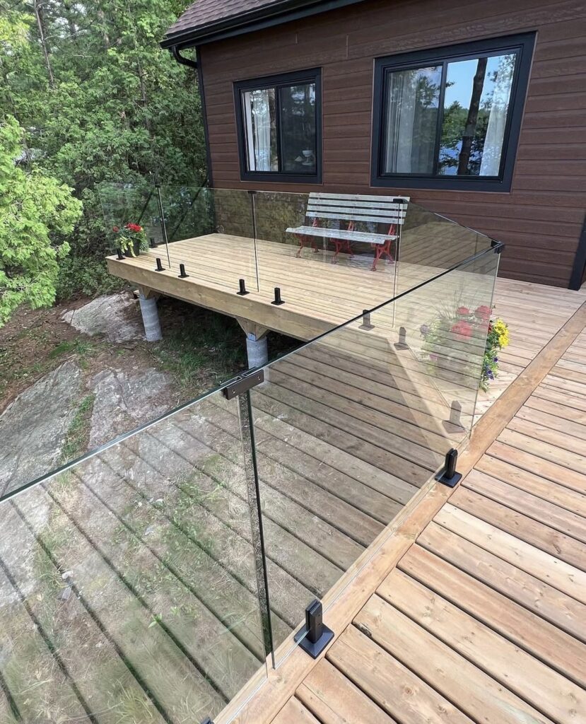 Balcony design with outdoor glass railing installation 