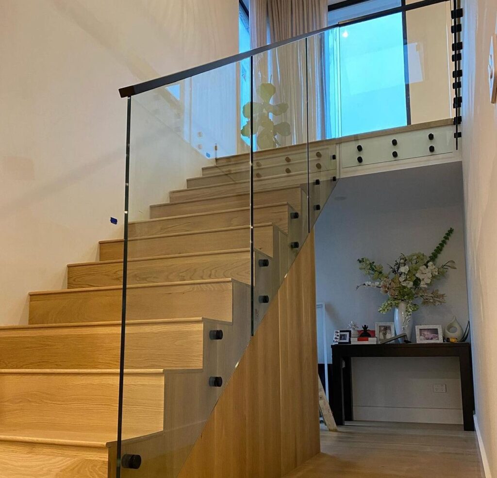 framed glass railing stairs shown