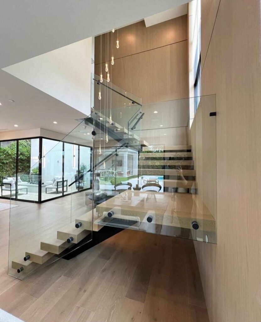 Stairs shown with frameless glass railing system