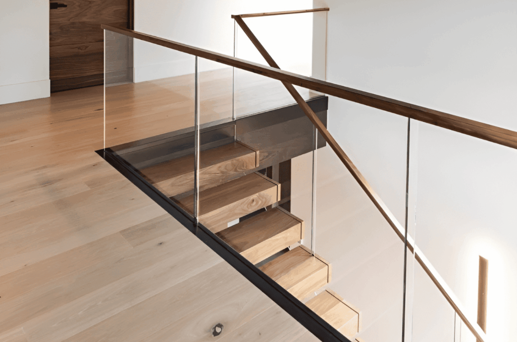 Floating wooden stairs with clear custom glass railings, highlighting elegant custom glass railing interior style