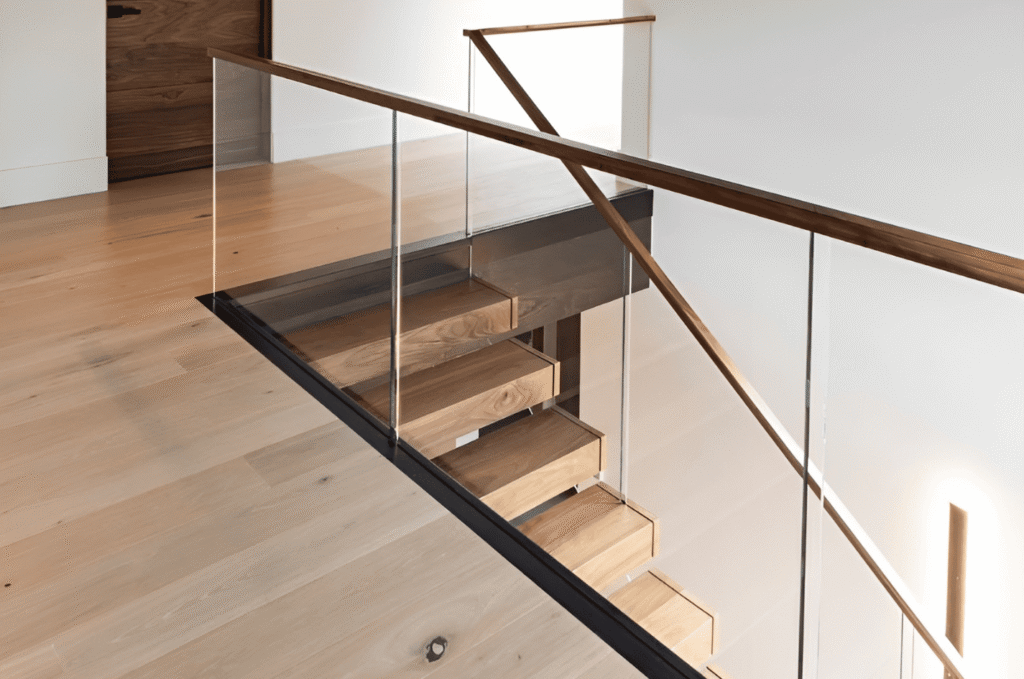  Minimalist staircase featuring a framed glass railing, wood steps, and open sightlines with modern house design