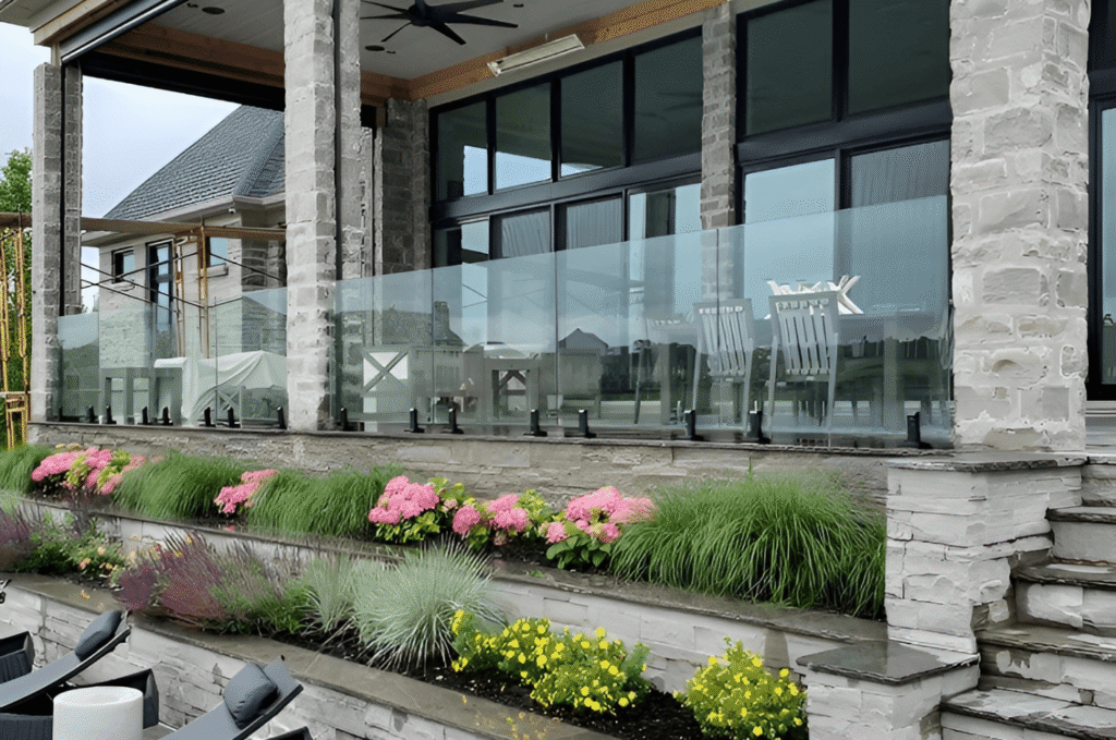 Glass railing installed along a covered patio, creating a safe barrier while keeping the outdoor seating area open