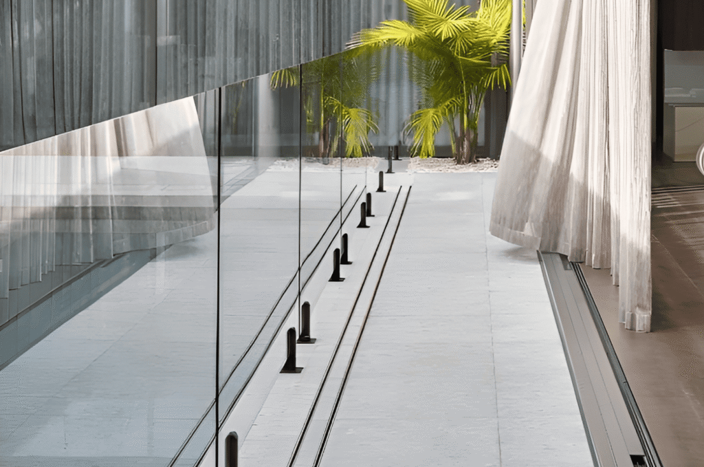 New glass railing panel aligned with even gaps and secured hardware for safe outdoor installation checks 